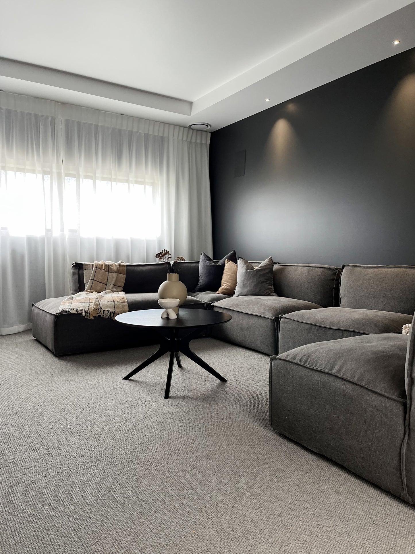 Modern, moody living room designed by Interior Designer Lucy Furniss